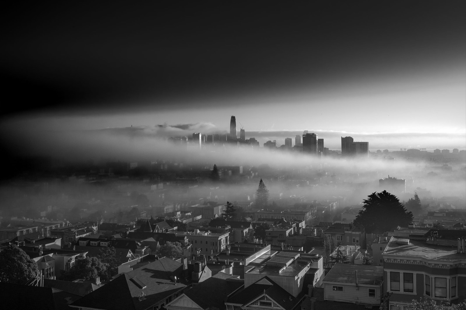 The San Francisco skyline emerging from fog, in high-contrast black and white. From the Unintentionally Moody collection.